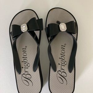 Black bow Brighton wedge flip-flops